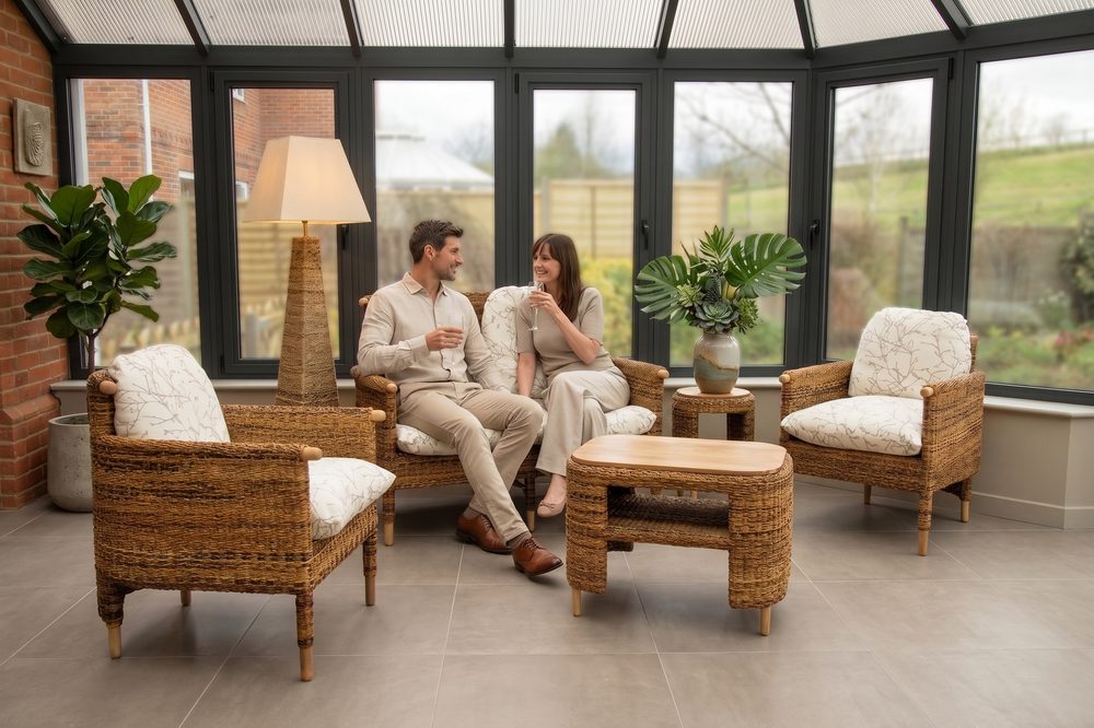 A couple on Bantul seating with matching armchairs and coffee table in a conservatory