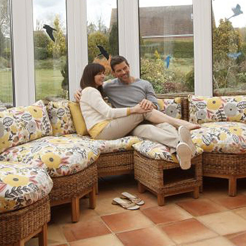 couple sitting on jepara sofa set