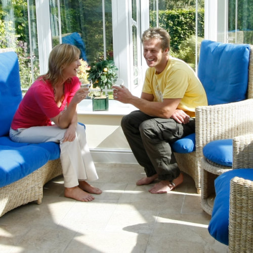 couple sitting on Kartosuro furniture in Geneva