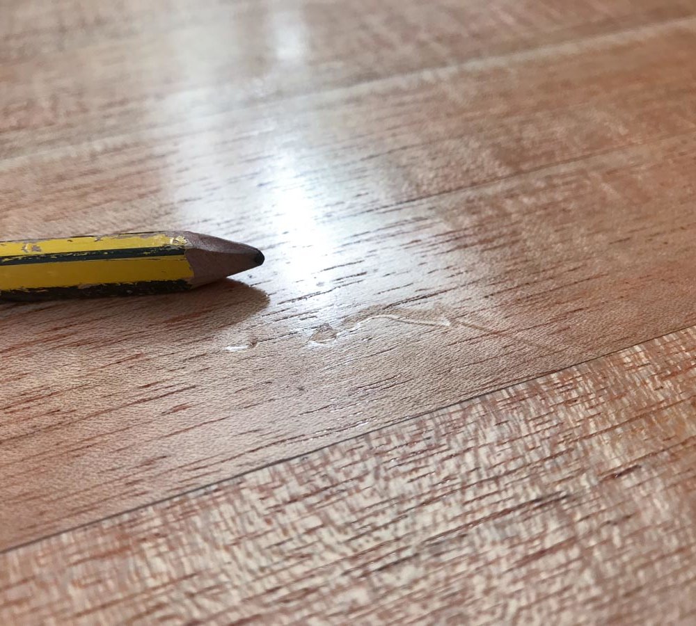 pencil on top surface of wooden table