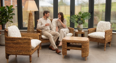 Bantul furniture arranged in a conservatory with models relaxing into a sofa